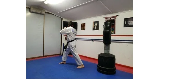 Instructor demonstrating look over shoulder for Round Back Kick