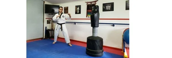 Instructor demonstrating the Standard fight stance for Round house Kick