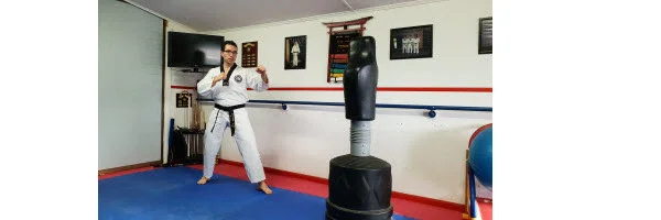 Instructor demonstrating how to twist the hip in doing Front Snap Kick