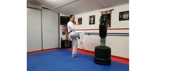 Instructor demonstrating how to recoil the kick in doing Front Snap Kick