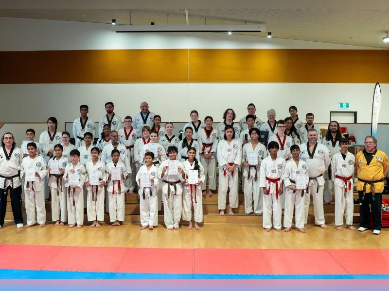 Group of Taekwondo students with the Masters