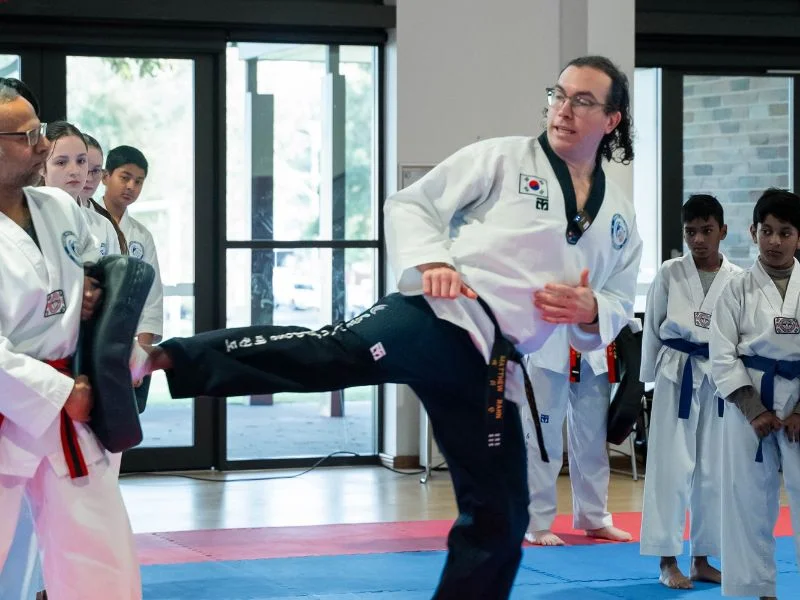 Instructor demonstrating how to kick
